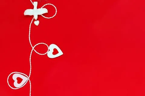 Top view of a minimalistic composition for Valentine's day on a red backgroun Stock Photos