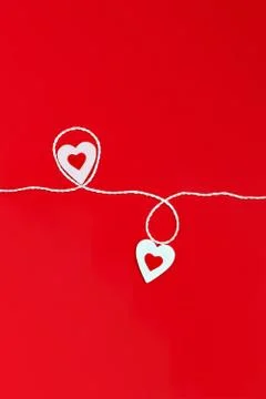 Top view of a minimalistic composition for Valentine's day on a red backgroun Stock Photos