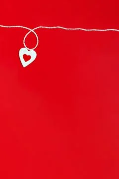 Top view of a minimalistic composition for Valentine's day on a red backgroun Stock Photos