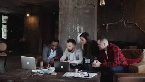 Top view of mixed race group of people standing near the table. Young business Stock Footage 131671531