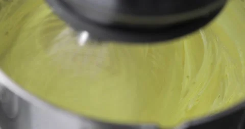 Top view of mixing process of ingredients for cooking cake using electric mixer Stock Footage 165805411