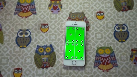 Top view mobile phone on the table with playing green screen slideshow Stock Footage 72126531