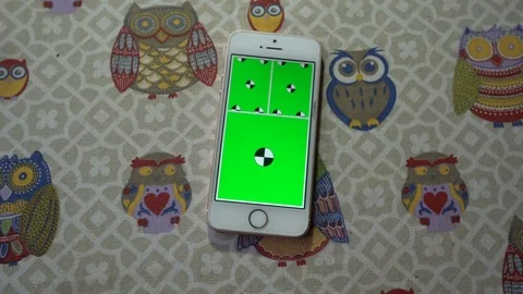 Top view mobile phone on the table with playing green screen slideshow Stock Footage 72132583