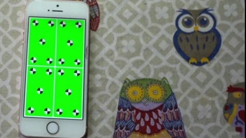 Top view mobile phone on the table with playing green screen slideshow Stock Footage 72132629