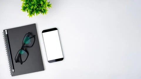 Top view of mock up modern workspace with blank screen smartphone, Coffee c.. Stock Photos