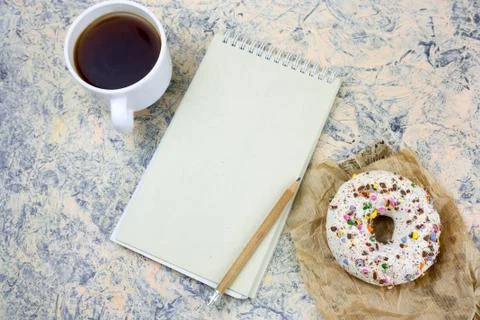 Top view mock up notebook with   blank  white paper sheet ,coffee cup and don Stock Photos