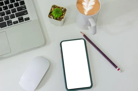 Top view mock up smart phone white blank screen and pencil coffee cup mouse.. Stock Photos