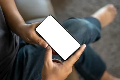 Top view Mockup image hand using a smartphone man Holding Cell Phone With Bla Stock Photos