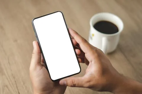 Top view Mockup image hand using a smartphone man Holding Cell Phone With Bla Foto stock