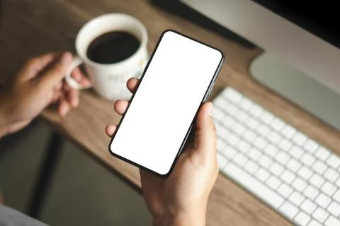 Top view Mockup image hand using a smartphone man Holding Cell Phone With Bla Foto stock