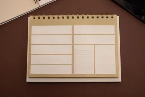 Top View Mockup Office Desk With Blank Notebook, Weekly Paper Planner And Gadget Stock Photos