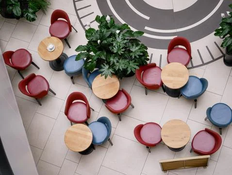 Top View of Modern Cafe Seating Area with Colorful Chairs Stock Photos