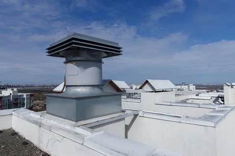Top View of a Modern Rooftop Ventilation System Surrounded by Urban Architecture Stock Photos