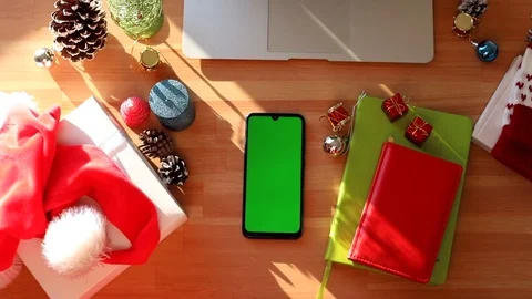 Top view of modern table with chromakey smartphone and. Christmas decoration int 動画素材 121738387