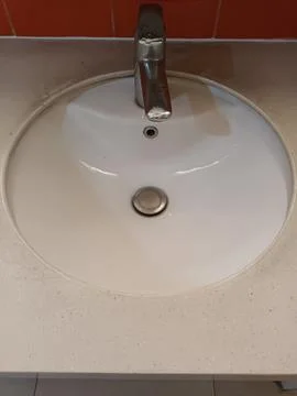 Top View of a Modern White Ceramic Sink with a Faucet Stock Photos
