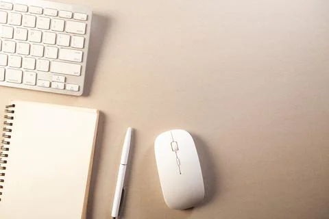 Top view of modern workspace with computer keyboard, mouse, pen, notebook a.. Stock Photos