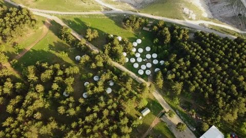 Top view of Mongolian tents set in a forest Stock Footage 258208513