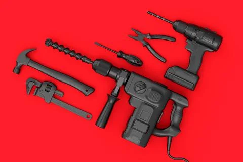 Top view of monochrome construction tools for repair on red background Stock Photos
