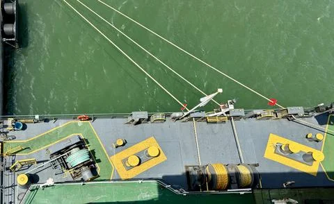 Top View of Mooring Deck and Lines from Ship Bridge While Docked at Port Stock Photos