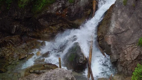 Top view of mountain flood river separating on two streams. Drone shot Stock Footage 127303717