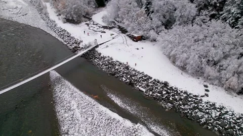 Top view of the mountain river and suspension bridge Stock Footage 170728436