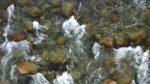 Top view of a mountain river full with boulders and crystal clear water Stock Footage 146352487