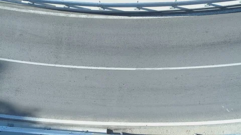 Top view of mountain road turn, black car passing trough Stock Footage 119311170