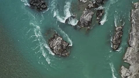 Top view of mountain strong river stream with turquoise water and rocky shores Stock Footage 194379553