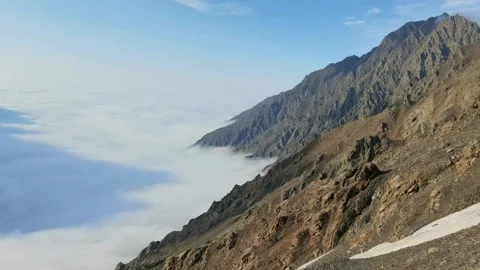 Top view of the mountain valley, which is covered by clouds. Stock Footage 173429393