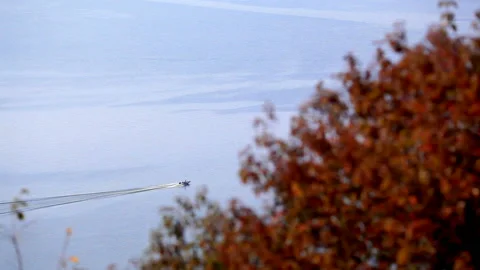 Top view from the mountain to a wide river with blue water and a motor ship Stock Footage 94227236
