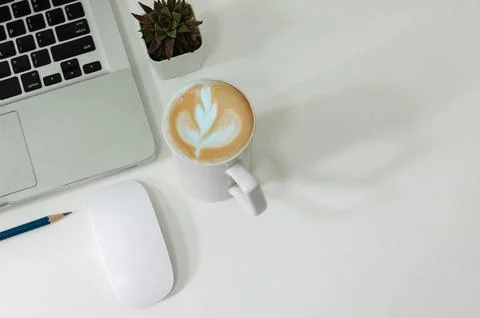 Top view mouse computer laptop and pencil coffee cup flat lay on desk. Stock Photos