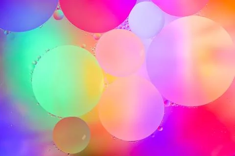 Top view movement of bubbles in the liquid. Oil surface multicolored backgr.. Stock Illustration