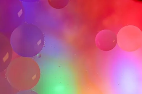 Top view movement of bubbles in the liquid. Oil surface multicolored backgr.. Stock Illustration