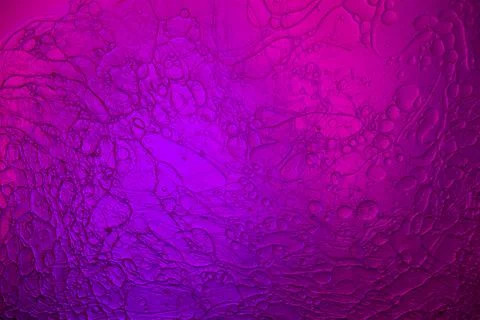 Top view movement of bubbles in the liquid. Oil surface multicolored backgr.. Foto stock