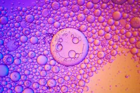Top view movement of oil bubbles in the liquid Stock Photos