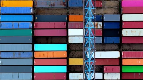 Top View of Moving Blue Crane Over Colorful Shipping Containers Stock Footage 341276192