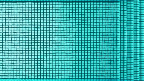 Top view of moving blue water in pool. Seamless looping. Stock Footage 247334440