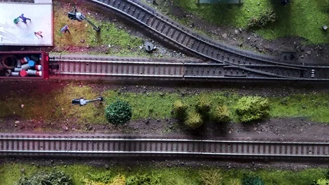Top view of a moving model of a steam locomotive. Detailed model of peron and tr Stock-Footage 119660632