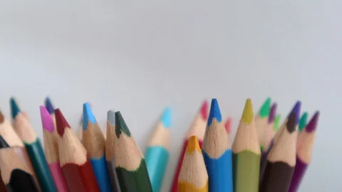 Top view on multi colored pencils rotating in white background. Close-up view Stock Footage 122450817
