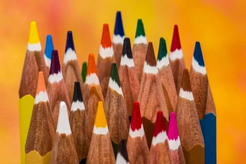 Top view on multi colored pencils rotating on white background. Close-up view Stock Photos