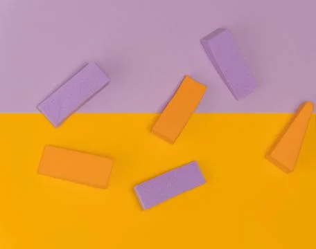 Top view of multi-colored sponges on different pastel-colored backgrounds. Ab Photos