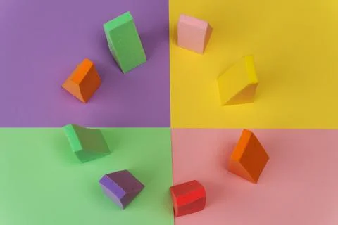 Top view of multi-colored sponges on different pastel-colored backgrounds. Ab Fotos de archivo