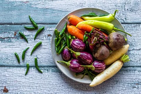 Top view of multi-colored vegetables (carrot, chili pepper, brinjal, radish) Stock Photos