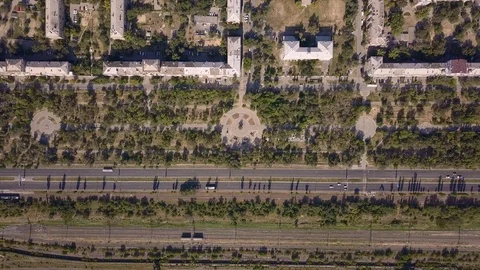 Top view of multi-lane road with movement of cars,railway,park,summer sunny day Stock Footage 113093467