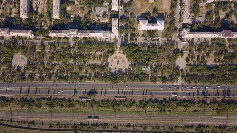 Top view of multi-lane road with movement of cars,railway,park,summer sunny day Stock Footage 113093573