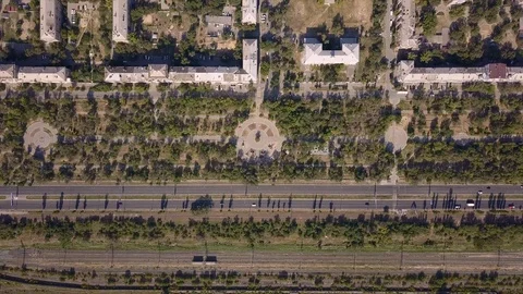 Top view of multi-lane road with movement of cars,railway,park,summer sunny day Stock Footage 113093801