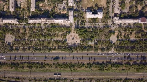 Top view of multi-lane road with movement of cars,railway,park,summer sunny day Stock Footage 113093905