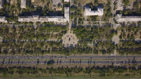 Top view of multi-lane road with movement of cars,railway,park,summer sunny day Stock Footage 113094028