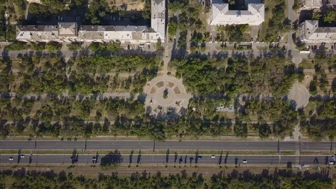 Top view of multi-lane road with movement of cars,railway,park,summer sunny day Stock Footage 113094187