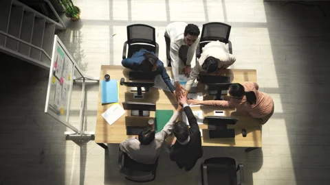 Top view of a multicultural business team stacking hands together 库存影片 339062681